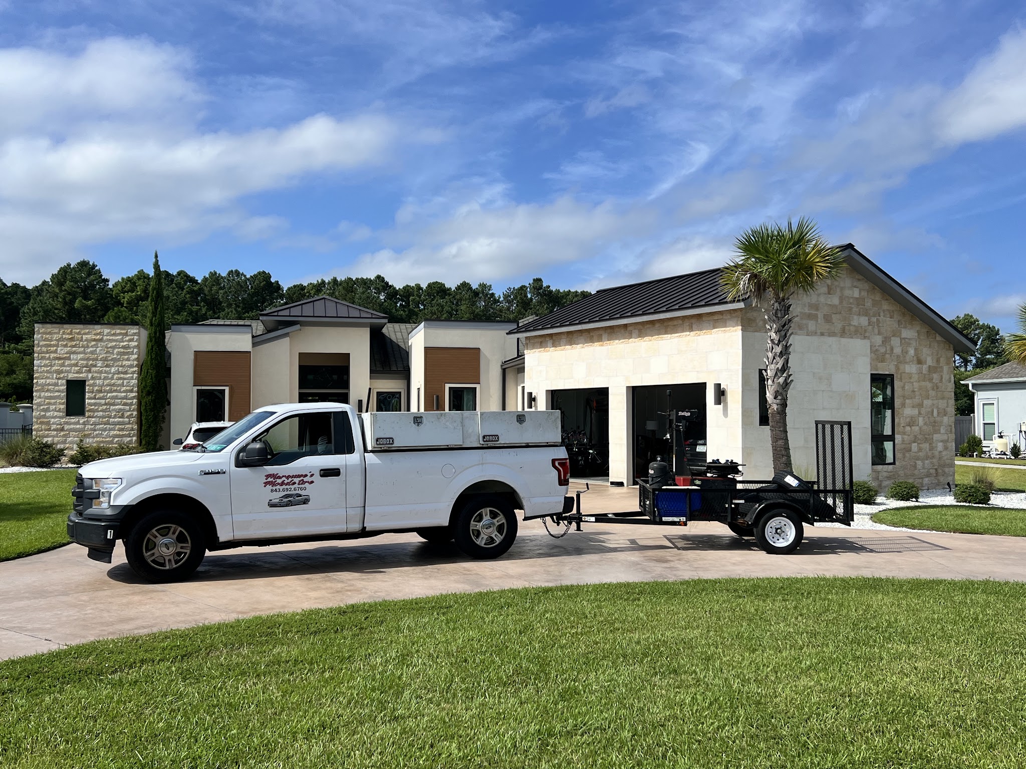 My work pickup and trailer parked outside a home