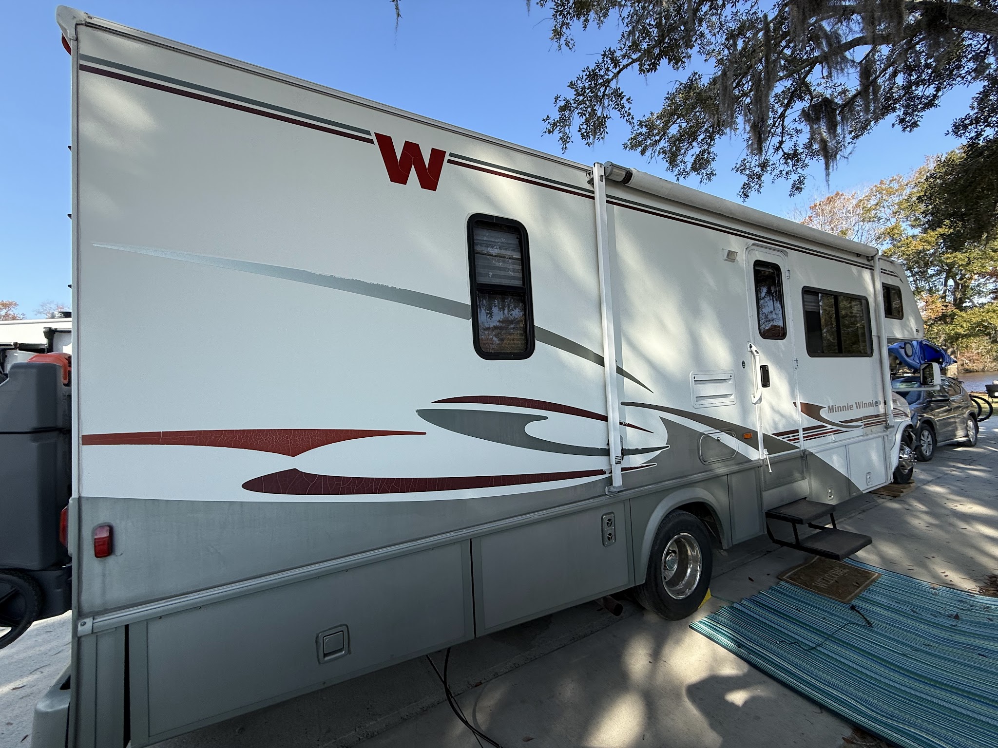 RV parked while its tire is being swapped